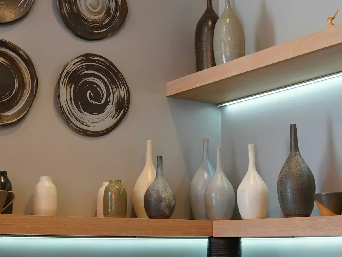 Ceramic vessels on open shop shelving